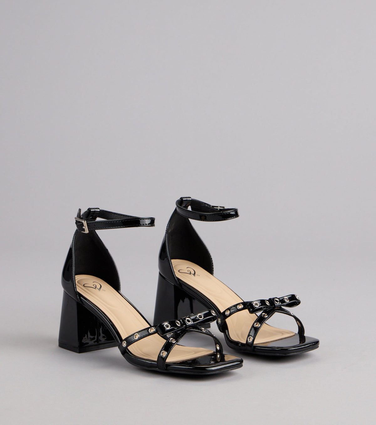 City Lights Bow Grommet Block Heels